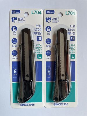 Cúter retráctil de 18 mm con bloqueo y protector de cuchilla
