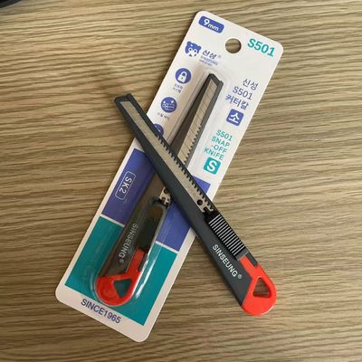Cuchillo de utilidad retráctil de mango de hierro con cuchillas de acero SK2 reemplazables